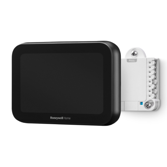 Black Honeywell Home smart device and white thermostat on a white background